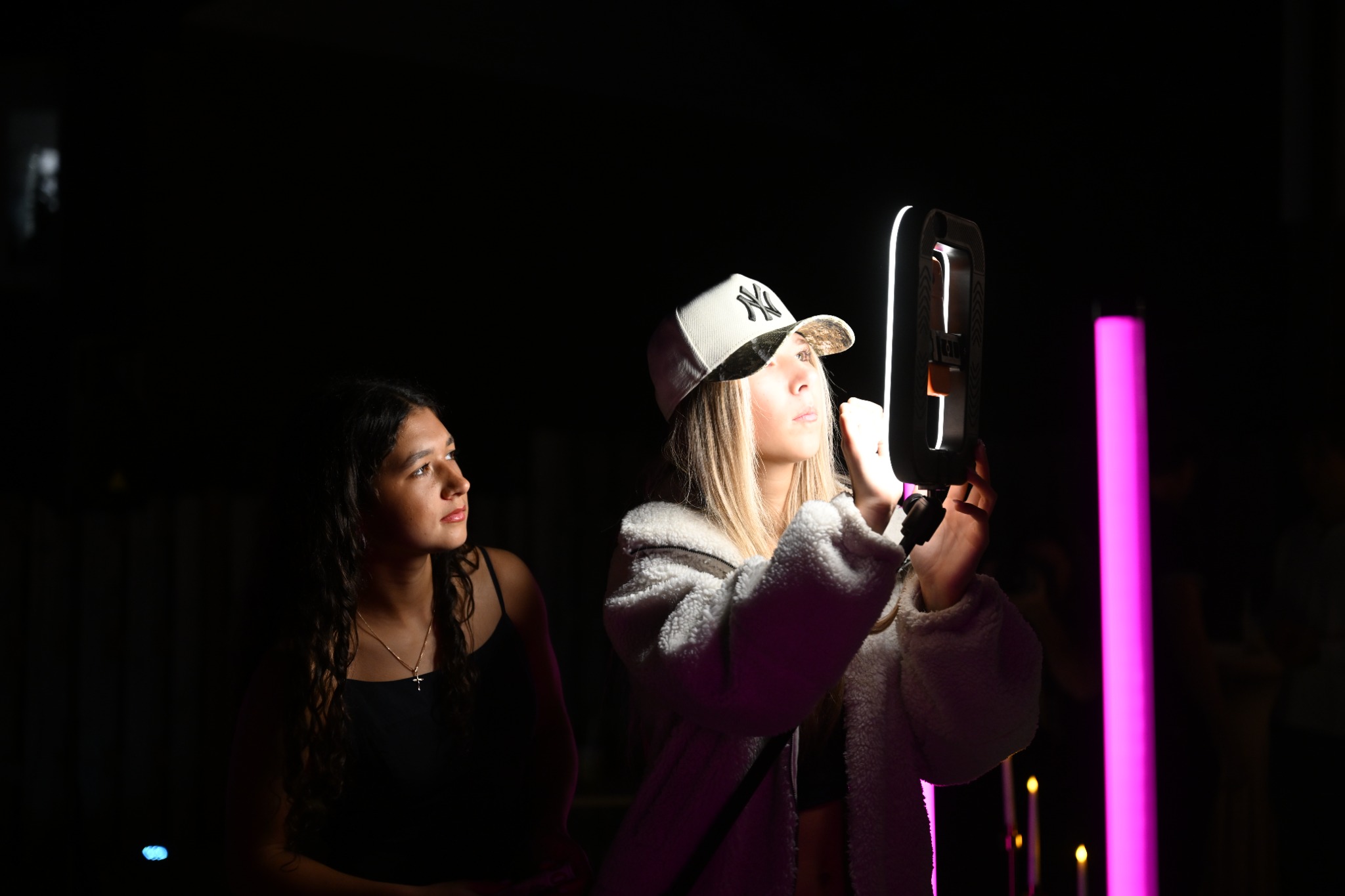 A guest using the booth screen to receive and share her 360 video